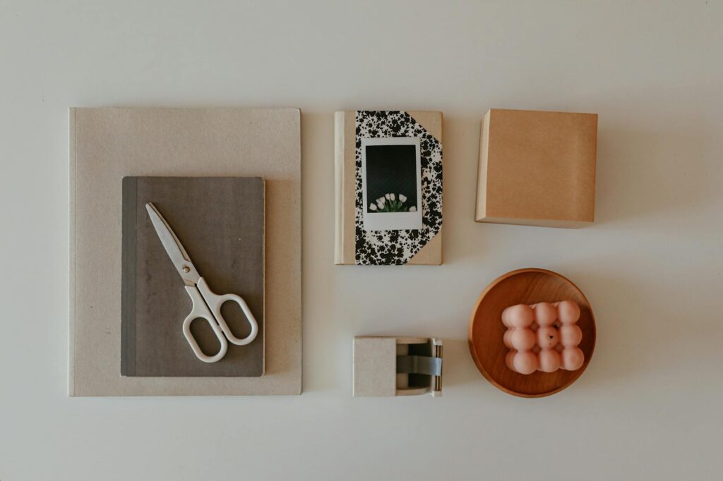 Organized desk with plant care tools, notebook, and humidity monitor